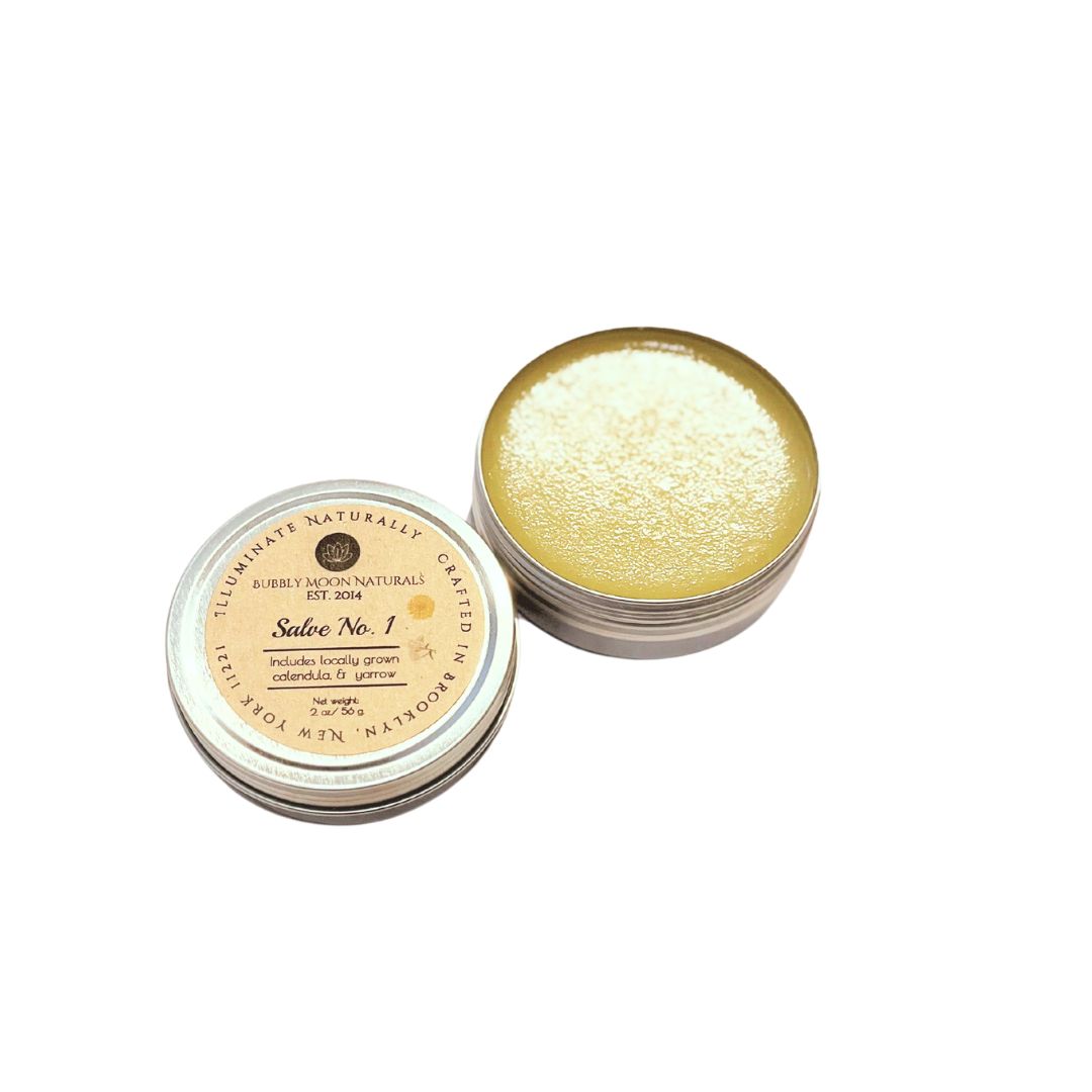 Salve No. 1 open with top and open round metal tin showing.